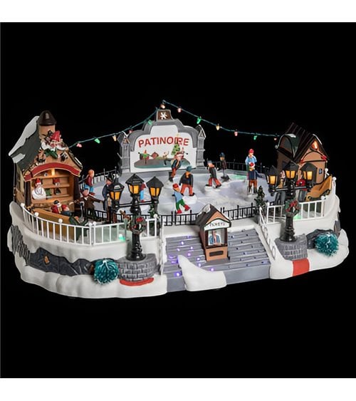 Pueblo navideño iluminado, pista de hielo